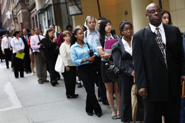 People wait in line to enter a job fair in New York last month.